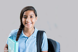 School child standing with a school bag symbolizing home tuition for class 1-12 in delhi & ncr