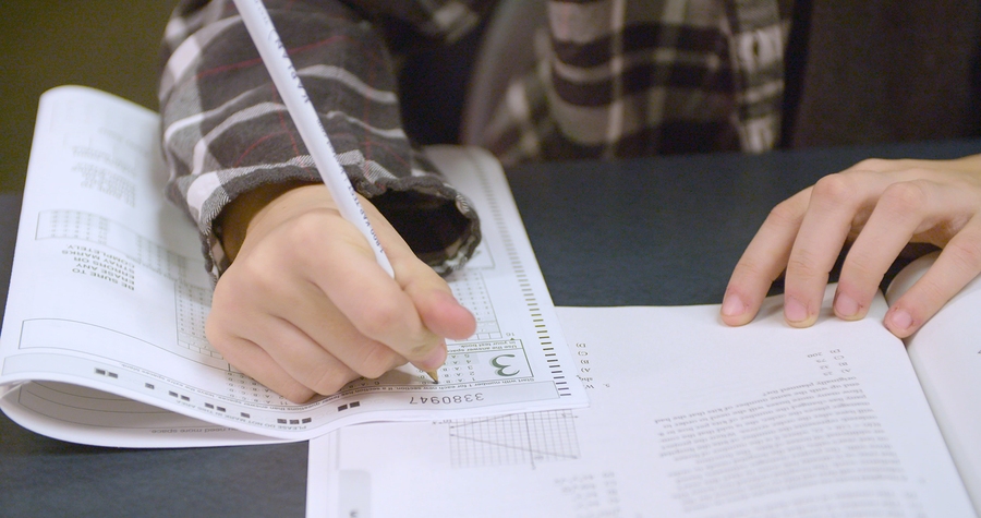 Student writing CBSE exam